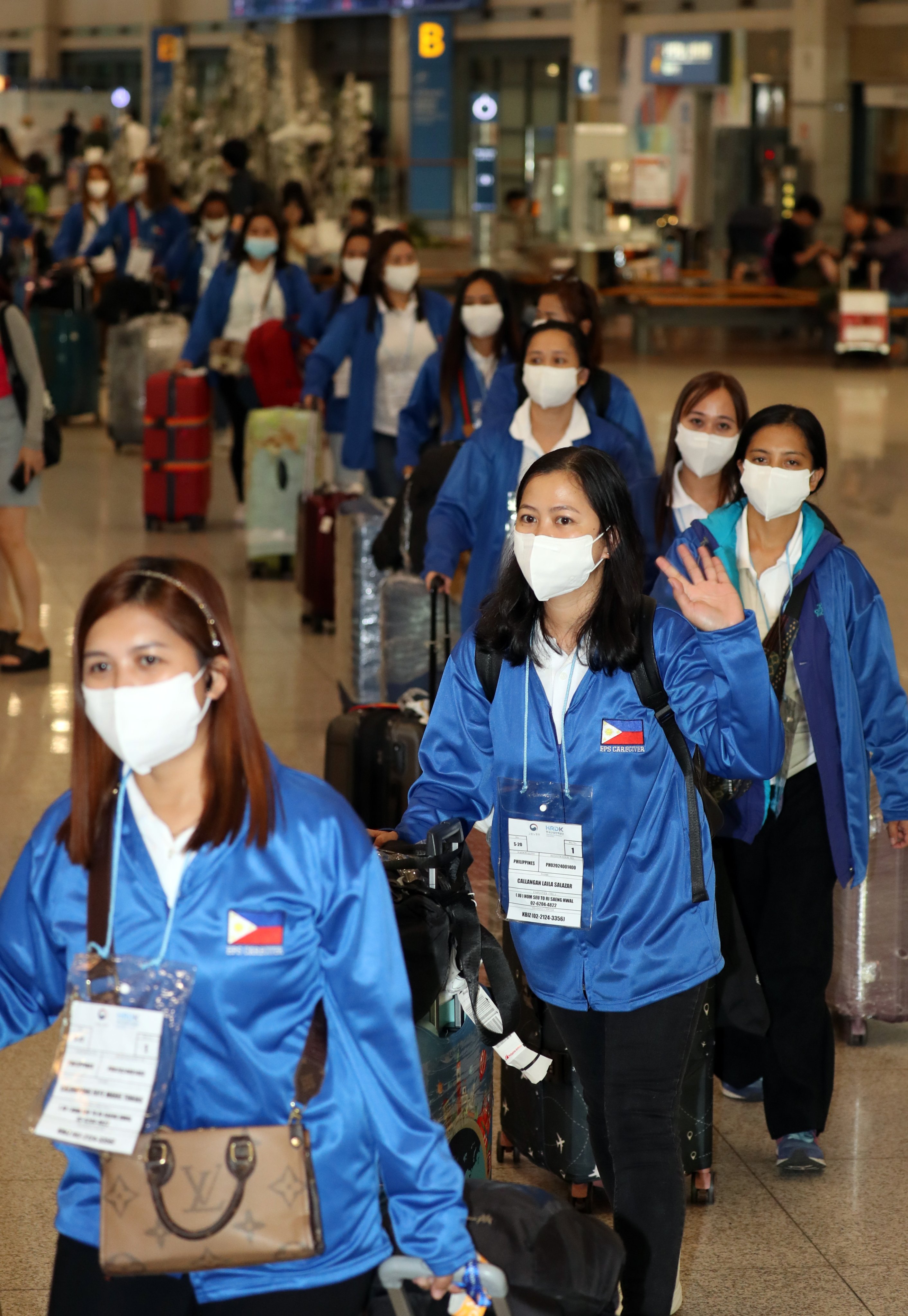 A group of 100 Filipino women arrive in Seoul on August 6 to take part in South Korea’s first-ever pilot project for domestic workers from the country. Photo: Yonhap/EPA-EFE