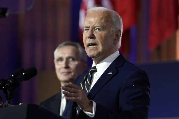 US President Joe Biden delivers remarks as Nato Secretary General Jens Stoltenberg looks on. Photo: EPA-EFE