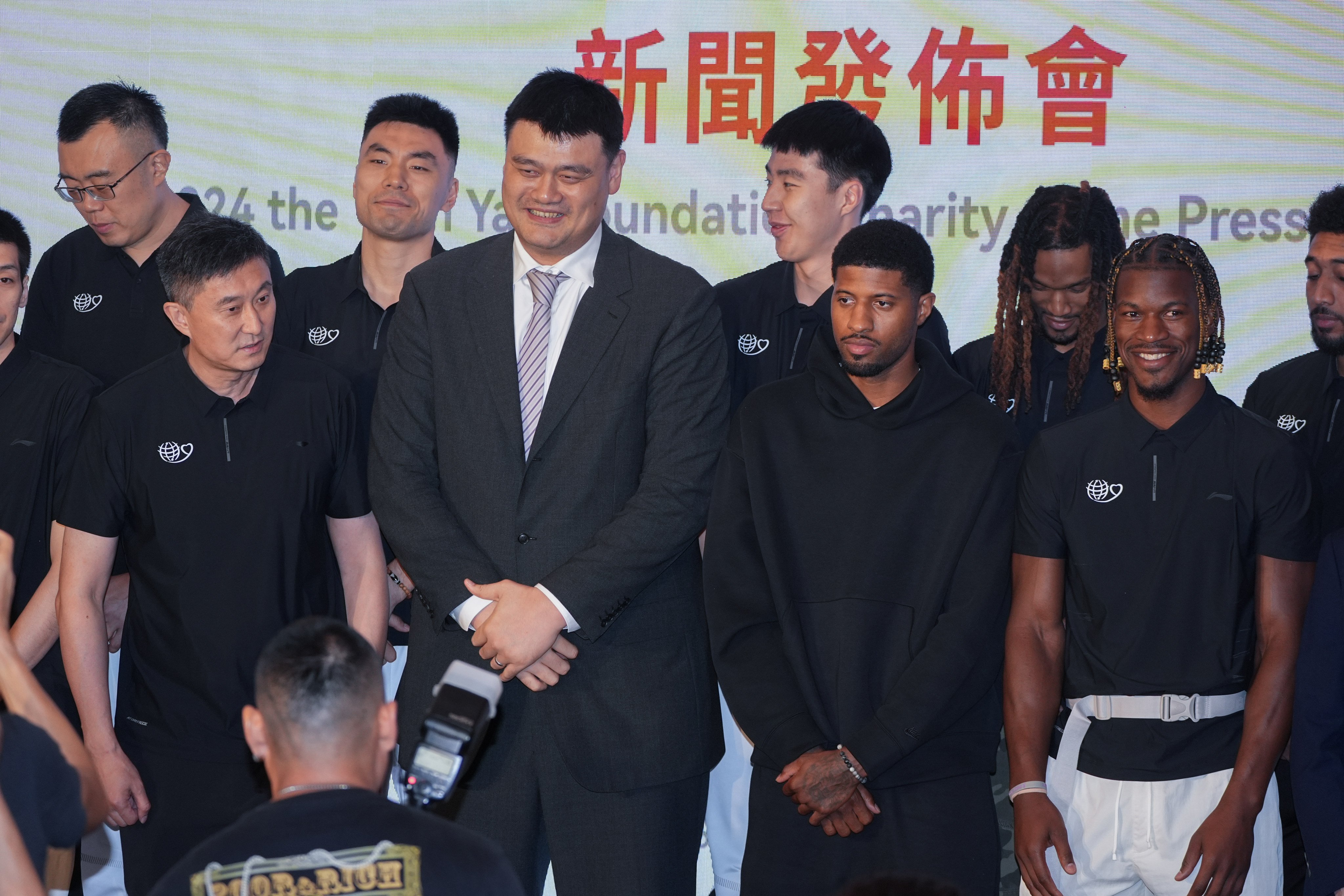 Chinese basketball legend Yao Ming, along with NBA stars Paul George and Jimmy Butler, pose for a photo during the 12th Yao Foundation Charity Game press conference at the Peninsula Hotel. Photo: Eugene Lee