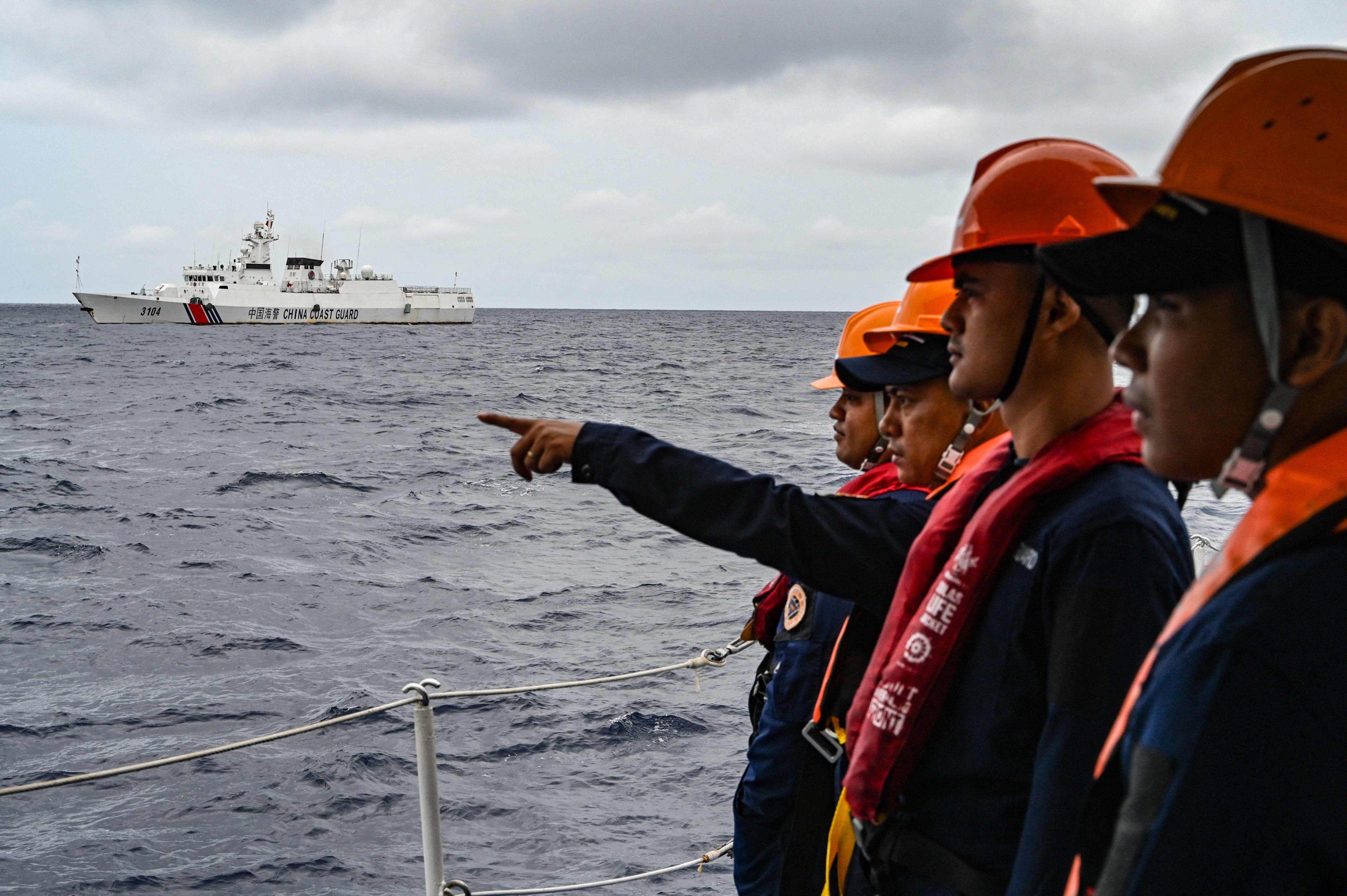 A Chinese coastguard ship is seen from a Philippine vessel during a supply mission to Sabina Shoal in the South China Sea on Monday. Photo: AFP